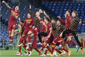  ??  ?? ROMA THERAPY Roma players celebrate after their hard-fought Derby victory