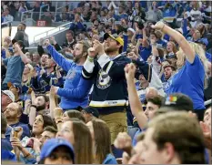  ?? SCOTT KANE — THE ASSOCIATED PRESS FILE ?? St. Louis Blues fans cheer as they watch television coverage of Game 7of the team’s Stanley Cup Final against the Boston Bruins last season from seats at Enterprise Center in St. Louis.