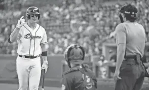  ?? JOSEPH SCHELLER/COLUMBUS DISPATCH ?? Clippers catcher Zack Collins has his challenge request denied because the umpire ruled Collins had been encouraged by teammates to initiate it.