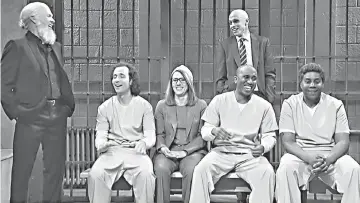  ??  ?? (Left) Michael Keaton as Assange; Pete Davidson plays Michael Avenatti (standing, right); (seated, left-right) Chris Redd, Kate McKinnon, Kenan Thompson and Kyle Mooney in the ‘SNL’ skit.