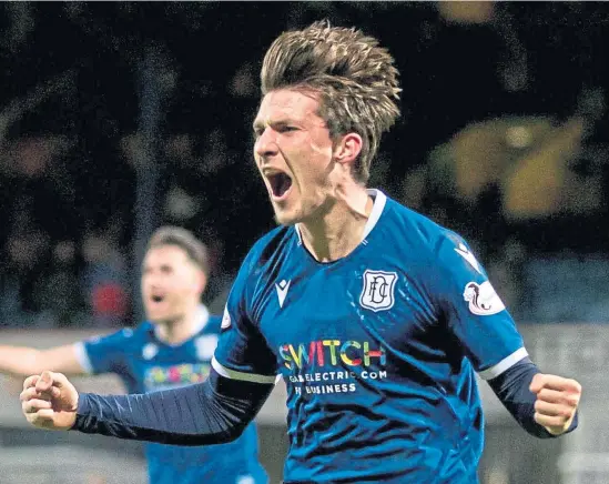  ?? Shuttersto­ck ?? Olly Crankshaw celebrates scoring the second goal in injury-time as the Dark Blues make it six games unbeaten.