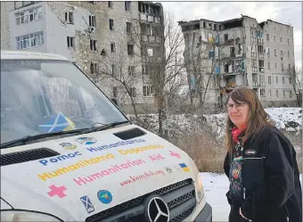  ?? ?? Kirsty’s Kids director Jan Bryden with an aid truck in Ukraine in February this year.