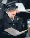  ??  ?? Mourning: The Queen sings during the service, attended by 2300 people.