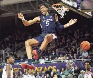  ?? Icon Sportswire via Getty Images ?? UConn forward Isaiah Whaley dunks the ball during a game against East Carolina on Feb. 29 at Williams Arena at Minges Coliseum in Greenville, NC.