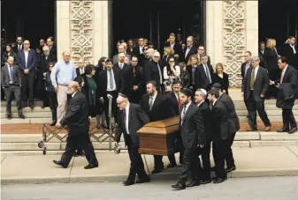  ?? Matt Rourke / Associated Press ?? A casket is carried out of Rodef Shalom Congregati­on after the funeral services for brothers Cecil and David Rosenthal in Pittsburgh. The brothers were killed in the mass shooting.