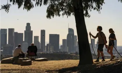  ?? Photograph: Damian Dovarganes/AP ?? The Los Angeles skyline. California is among the seven states losing a seat in the House.