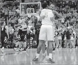  ?? [ADAM CAIRNS/DISPATCH] ?? Tennessee’s Admiral Schofield hugs Grant Williams following the Volunteers’ hard-fought win over Iowa.