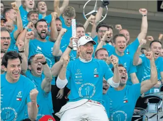  ?? /Zeya Tun/Reuters ?? Number one: Valtteri Bottas, in white cap, celebrates his Japanese Grand Prix victory with the Mercedes team.
