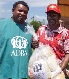  ??  ?? Adventists Developmen­t & Risk Agency (ADRA) Fiji staff providing aid.