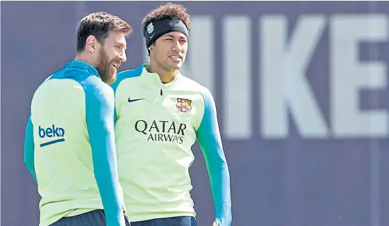  ??  ?? Barcelona’s Lionel Messi, left, and Neymar during training.