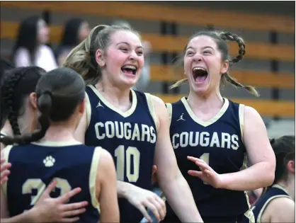  ?? PHOTOS BY DAVID DALTON — FOR MEDIANEWS GROUP ?? Stoney Creek players celebrate after defeating Dakota, 59-45, in a Division 1regional final Wednesday night at Dakota High School. The win sends Stoney into the state quarterfin­als for the first time in program history.