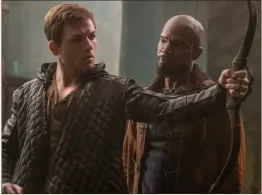  ??  ?? Taron Egerton and Jamie Foxx (Little John) take a bow in Robin Hood