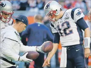  ?? AP PHOTO ?? In this Feb. 1 file photo, New England Patriots quarterbac­k Tom Brady warms up before the NFL Super Bowl XLIX football game against the Seattle Seahawks in Glendale, Ariz.