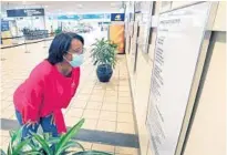  ?? JOE BURBANK/ORLANDO SENTINEL ?? Poet Valada Flewellyn is featured in the “Words in Flight” exhibit at Orlando Internatio­nal Airport.