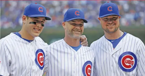  ?? CHARLES REX ARBOGAST/AP ?? Anthony Rizzo (left) and Jon Lester (right) are tight with David Ross, who was officially announced as Joe Maddon’s successor Thursday.