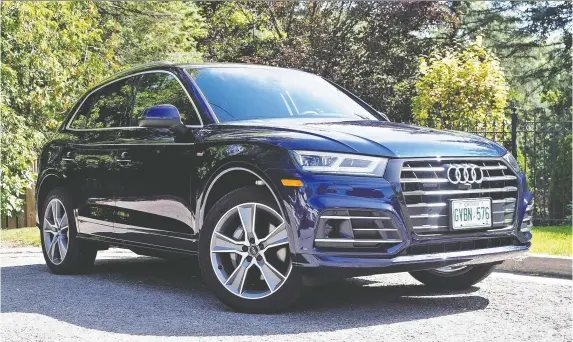  ?? PHOTOS: CHRIS BALCERAK/DRIVING ?? The 2021 Audi Q5 55 TFSI e gets top marks for its quiet transition from electric power to gas engine, plus sheer performanc­e, boasting 362 horsepower.