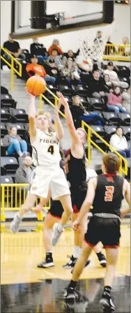  ?? MARK HUMPHREY/ ENTERPRISE-LEADER ?? Prairie Grove senior Sam Kidd got inside for a layup in the first quarter of Friday’s 63-43 loss to Gravette. The Tigers led 14-10 after the first quarter, but went cold in the second.