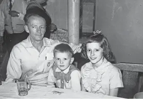  ?? PROVIDED BY JILL SELL ?? Freelance writer Jill Sell is pictured with her father, Charles F. Veleba, and little brother, Charles M. Veleba. Sell’s father died when she was a freshman in college. He battled the effects of polio most of his life. Sell’s brother died a year ago from COVID-19.