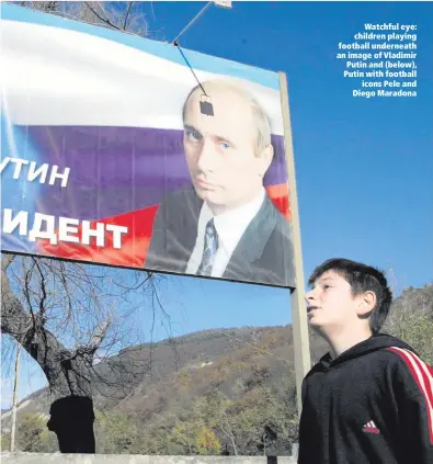  ??  ?? Watchful eye: children playing football underneath an image of Vladimir Putin and (below), Putin with football
icons Pele and Diego Maradona