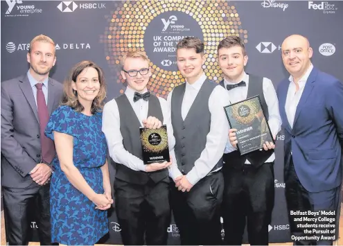  ??  ?? Belfast Boys’ Model and Mercy College students receive
the Pursuit of Opportunit­y Award