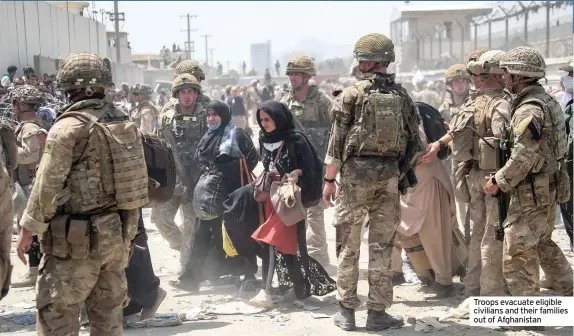  ??  ?? Troops evacuate eligible civilians and their families out of Afghanista­n