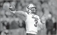  ?? AP-David J. Phillip ?? South Carolina quarterbac­k Ryan Hilinski (3) throws a pass against Texas A&M on Nov. 16 in College Station, Texas.