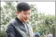  ?? PROVIDED TO CHINA DAILY ?? Yang Jianhua checks leaves at a tea garden.