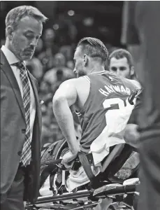  ?? (AP PHOTO/TONY DEJAK) ?? HURT. Boston Celtics' Gordon Hayward is carried away in a stretcher in the first half of an NBA basketball game against the Cleveland Cavaliers, Tuesday, Oct. 17, 2017, in Cleveland. Just five minutes into his Boston career, the new Celtics star...