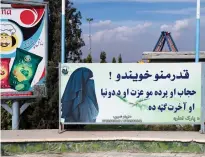  ?? — afp ?? A poster in Pashto language at the Habibullah Zazai Park on the outskirts of Kabul reads: “Dear sisters! Hijab and veil are your dignity and are in your benefit in this world and in the hereafter.”