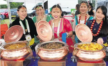  ?? 13770217 ?? There was a range of traditiona­l food bubbling away at a stall run by the Ashford branch of the KYC in Benover Road, Yalding