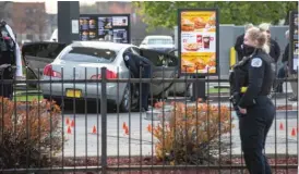  ?? SUN-TIMES FILE ?? Markers identify bullet casings as police investigat­e the scene where 7-year-old Jaslyn Adams was fatally shot at a McDonald’s drive-thru in Lawndale last month.