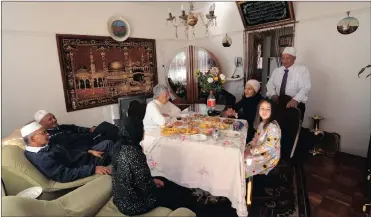  ?? Picture: HENK KRUGER/ANA PICTURESE ?? FAMILY TIES: The Dramat family opened their house for the Cape Times on Eid. From left are: Ridewaan Dramat, 63; Noor Ajan, 58; ladies in front of them Faieeza Saieed, 65; Margaret Damascio, 82; Musmuna Dramat, 57; Naeels Damascio, 5; and Yusuf Saieed,...