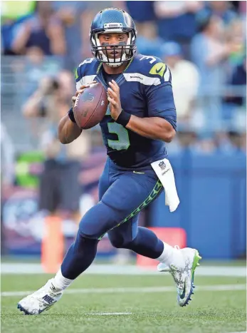  ?? JOE NICHOLSON, USA TODAY SPORTS ?? Quarterbac­k Russell Wilson proved he could carry the Seahawks in last season’s stretch drive.