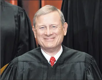  ?? Erin Schaff
The New York Times ?? Chief Justice John Roberts sits during a group photo at the Supreme Court in Washington in 2021. Roberts made his first public appearance since the court overturned Roe v. Wade Friday night at a judicial conference in Colorado.