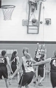  ??  ?? Cobi Morris goes for the shot as the EDSS senior girls’ basketball team earned a resounding victory over FHCI on Sept. 22 with a 43-11 win.