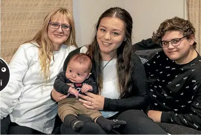  ?? STACY SQUIRES/ STUFF ?? Kiri Talbot, nee Te Rangi, with her Vietnamese daughter Jimaya Te Rangi-Henare, holding 10-weekold Mekhi, and Ma¯ ori son Matua Talbot.