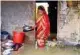  ?? ?? A woman at her flooded house