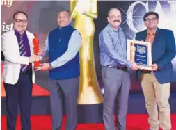  ?? ?? Sanjay P Rathi, CMD, Sampark India Logistics and Sawan Maheshwari receiving Best Multimodal Transport & Logistics Company Award at the recent India Cargo Awards