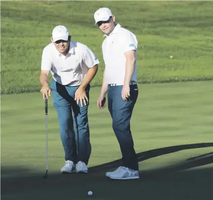  ?? Picture: Getty Images ?? DEADLY DUO. The pairing of Branden Grace and Louis Oosthuizen was a shining light for the Internatio­nal team during the day one foursomes at the Presidents Cup on Thursday.