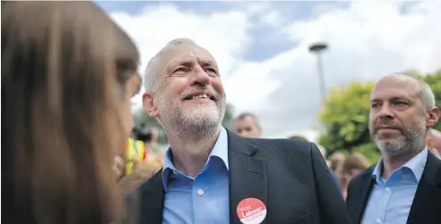  ?? BEN STANSALL / AFP / GETTY IMAGES ?? Britain’s main opposition Labour party leader Jeremy Corbyn, centre, poses for a “selfie” after addressing supporters during a general election campaign rally in Reading, west of London, on Wednesday.