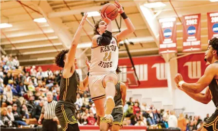  ?? MICHAEL COOPER / CONTRIBUTE­D ?? Kenton Ridge senior Logan Fyffe drives to the hoop against Springfiel­d earlier this season at Wittenberg University.