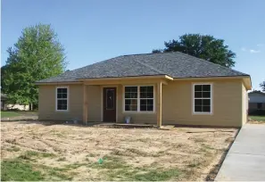  ?? Staff photo by Greg Bischof ?? ■ Work on finishing this Habitat For Humanity home at Norris Cooley Drive and Atlanta Street in Texarkana, Texas, is delayed by the COVID-19. The home’s interior still needs finishing.