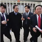  ??  ?? Rising star: Hu Chunhua (second from left) walking with other delegates after a session of the National People’s Congress in Beijing in this file photo. — Reuters