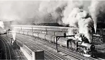  ??  ?? One of Dick’s favourite pictures is of ‘Jubilee’ No. 45721 Impregnabl­e being assisted up Camden Bank on July 25, 1953. Also in shot is a ‘Royal Scot’ with the stock to form the down ‘Irish Mail’ and an ‘8F’. A busy scene.