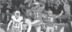  ?? AP ?? Philadelph­ia Eagles wide receiver A.J. Brown (11) scores a touchdown during the second half of Sunday’s game against the Miami Dolphins in Philadelph­ia.