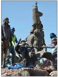  ?? (AP/The Albuquerqu­e Journal/Jim Thompson) ?? Workers remove the statue of Spanish explorer Juan de Onate on Tuesday outside the Albuquerqu­e Museum in New Mexico. More photos at arkansason­line.com/617nm/.