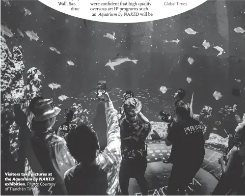  ?? Photo: Courtesy of Tianchen Times ?? Visitors take pictures at the Aquarium by NAKED exhibition.