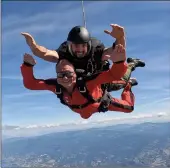  ?? ?? Reporter Mark Brett, with Master Cpl. Marc Dumaine of the Skyhawks Parachute Team, is pictured in the air and landing at the Penticton Regional Airport, Tuesday morning.