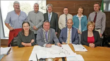  ??  ?? At the Orchard Park contract signing in Enniscorth­y Council Chamber last week were, back row: Cllr Paddy Kavanagh, Cllr. Johnny Mythen, Cllr. Willie Kavanagh, Cllr. Kathleen Codd-Nolan and Rory O’Mahoney, Wexford County Council. Front: Liz Hore,...
