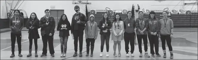  ?? Photo by Lizzy Hahn ?? SCIENCE ROCKS— During the April 21 Nome-Beltz High School assembly, science teachers Sarah Liben and Michael Deering presented the science fair winners with their awards. This school year had the highest turnout of science fair participan­ts compared to previous years.